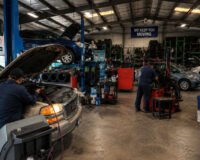 Affordable Auto Care & Tires Sugar Land TX auto repair shop with mechanics servicing vehicles